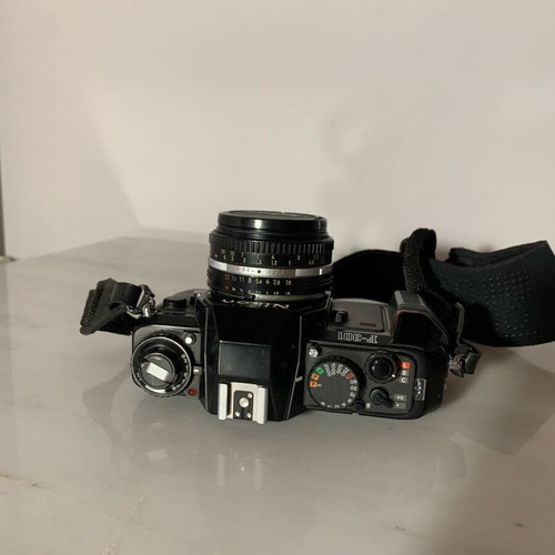 Nikon F-301 with nikkor 50mm 1:1.8 lens and HoyaHMC filter like new