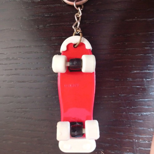 Mini skateboard keychain used with blue elephant design