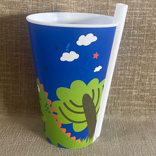 Plastic cup with dinosaur design and straw used