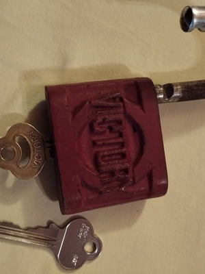 Old padlock used with key and skeleton key