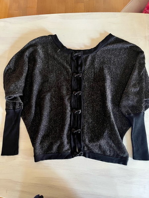 Black blouse like new with bows on back, size Medium