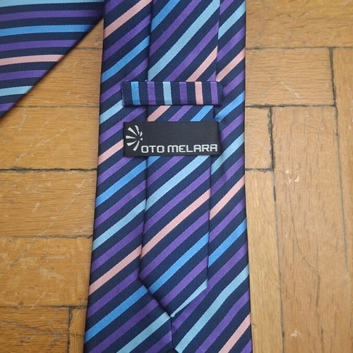 Otomelara tie with diagonal stripes in purple, black, mauve and blue