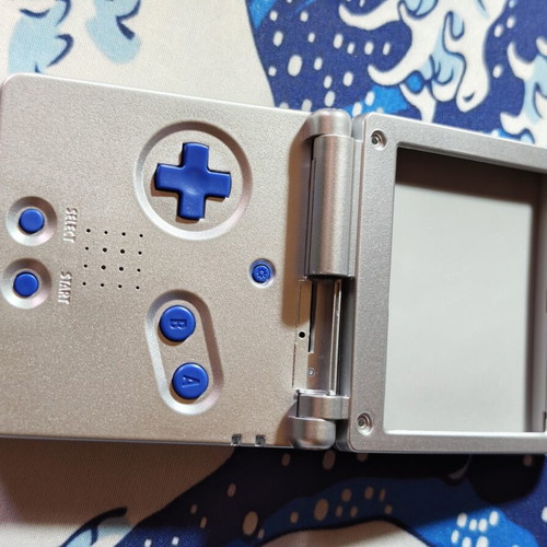 Silver Gameboy Advance SP shell with embossed Kyogre UV print