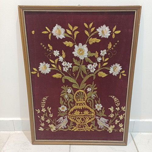 Embroidered textile painting used with gold thread on velvet