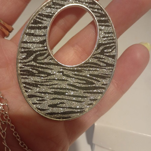 Avon Animal Magnetism pendant new with zebra print