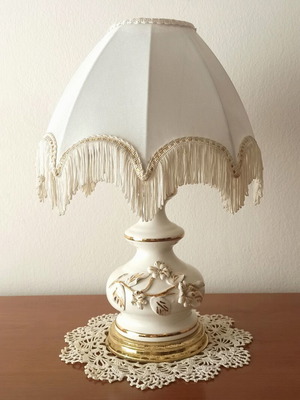 Vintage porcelain table lamp with fabric white shade and fringes used