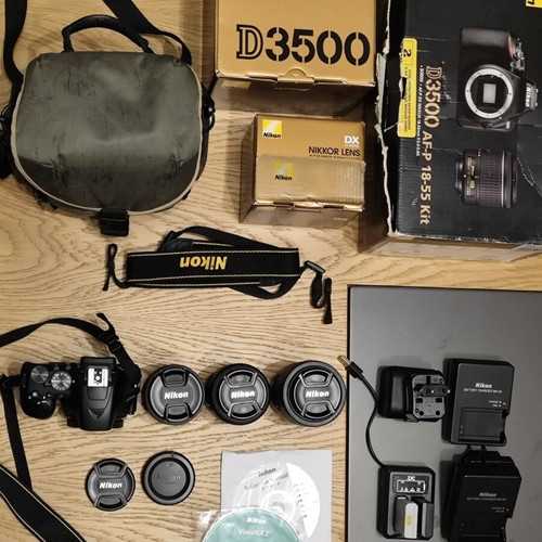 Nikon D3500 DSLR camera body with 3 lenses and accessories