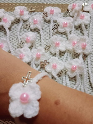 Handmade martyr bracelet with flower, cross, and pearl made to order