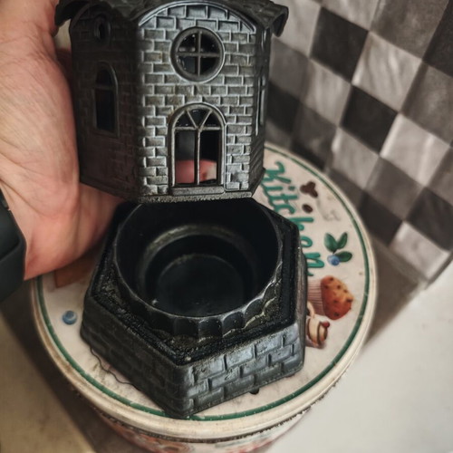 Candle holder used, church-shaped without glass cup, black