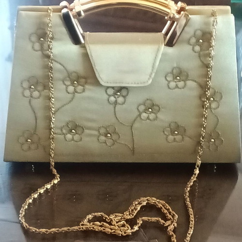 Small gold handbag with handle and long chain, like new