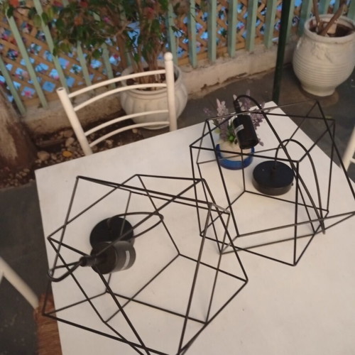 Two rhombic metal ceiling lights