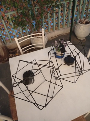 Two rhombic metal ceiling lights