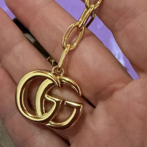Gucci gold necklace with large GG pendant and chain, new