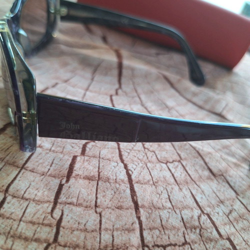 John Galliano sunglasses used, distinctive purple