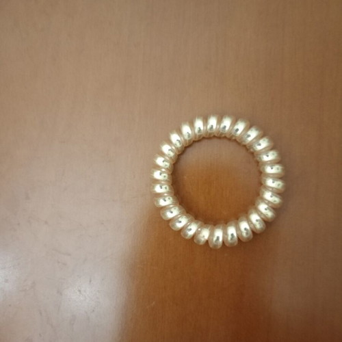 Spiral Hair Tie like new, shiny gold color