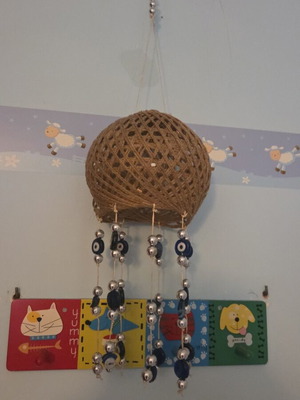 Ceiling decoration with blue matohandra beads, about 70 cm height