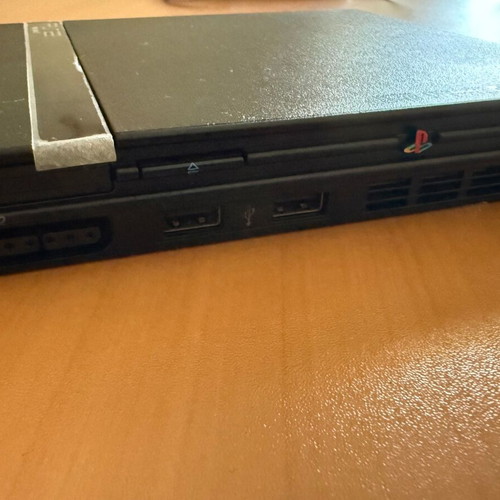 PlayStation 2 Slim console with original Sony accessories