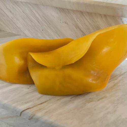 Handmade decorative candle with irregular shape, like new, yellow