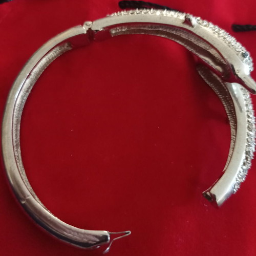 Bangle bracelet with dolphin design and sparkling rhinestones like new, silver