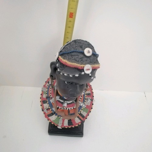African figurine like new with intricate bead jewelry