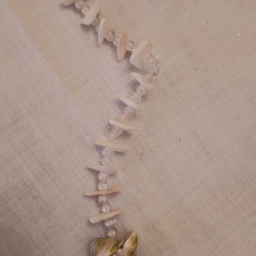 Long necklace made of shells like new, beige and brown
