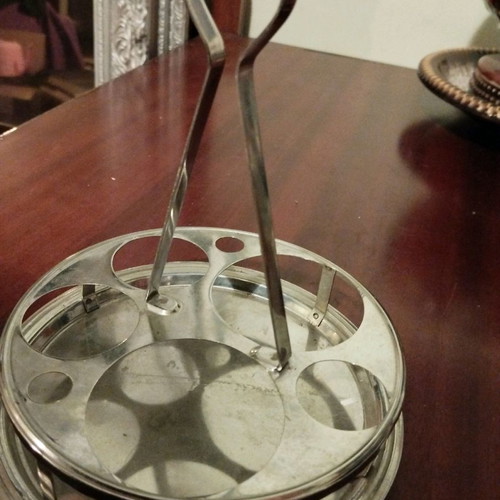 Metal cafe-style coaster used, for small glasses