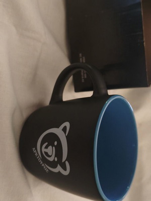 Arcturos Ceramic Mug new, black matte finish with blue interior