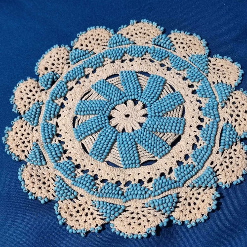 Handmade knitted doilies used with crochet and beads