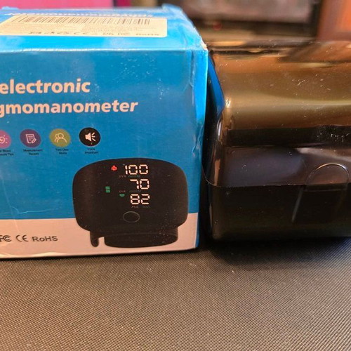 Wrist Electronic Blood Pressure Monitor new with case and rechargeable battery