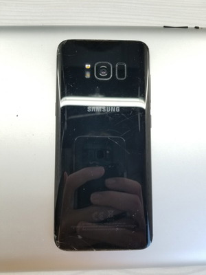 Samsung S8 smartphone with cracked screen and new battery