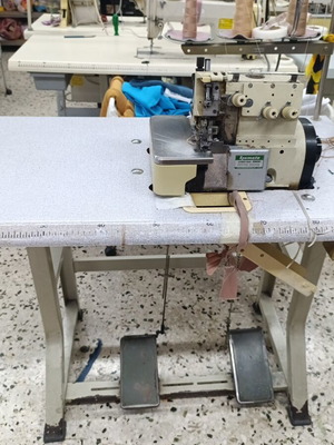 Festoni sewing machine used for decorative finishes