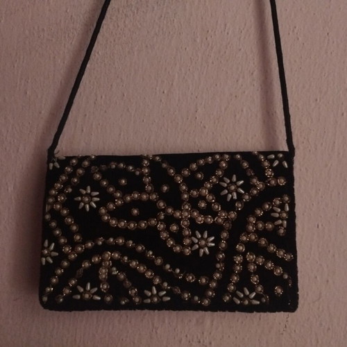 Black crossbody bag decorated with silver embroidery and beads