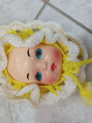 Vintage handmade wall decoration with plastic face