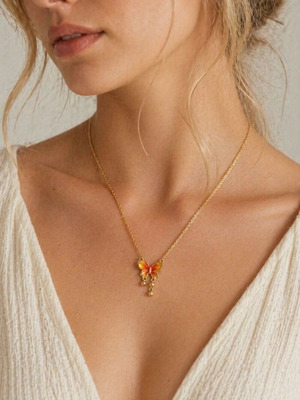 Gold necklace with butterfly, like new, orange accents