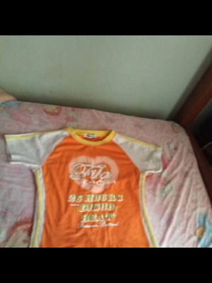 Short-sleeve orange and white t-shirt with print used