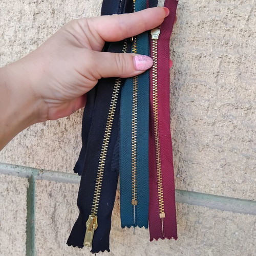 Metal and plastic sewing zippers YKK, assorted colors and sizes, pack