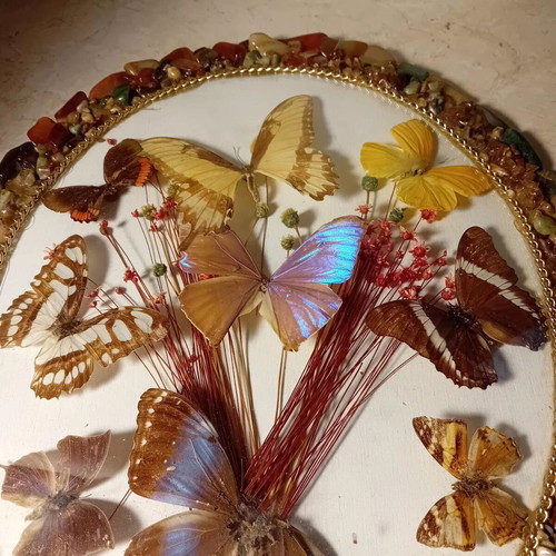 Vintage framed art with colorful stones and butterflies