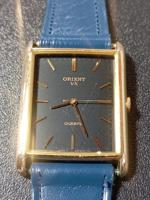 Vintage Orient men's watch used with blue leather strap