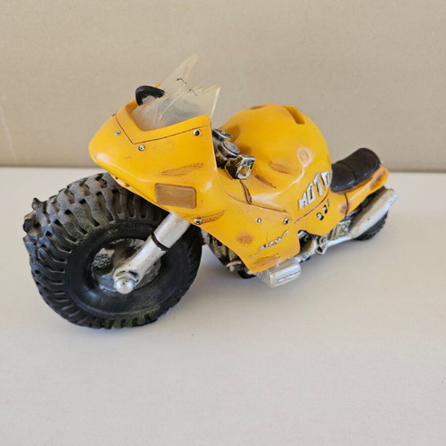 Motorcycle figure piggy bank used with crashed design