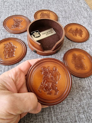 Leather coasters like new with embossed decoration and leather holder