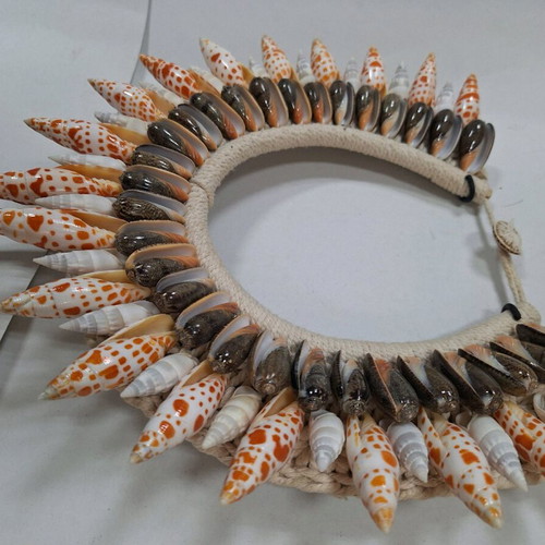 Decorative shell necklace like new on custom stand