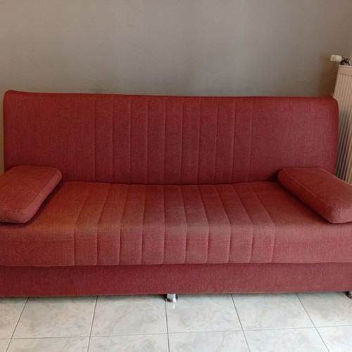 Three-seater sofa bed with storage space