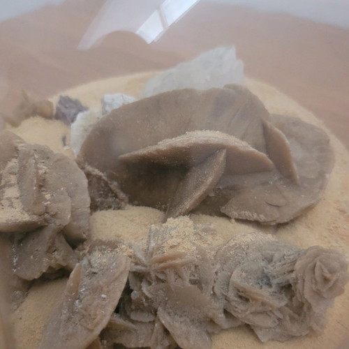 Desert rose used with agate and amethyst in glass bowl