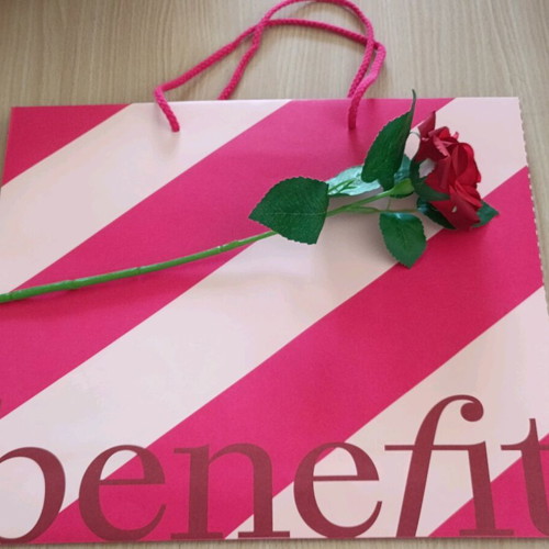 Benefit paper bag with artificial red rose new