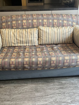 Two-Seater Sofa Bed used, practical and space-saving