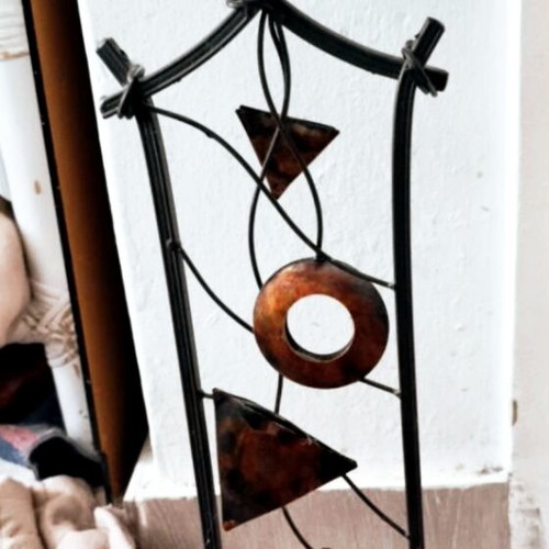 Metal decorative stand with candle like new, geometric design