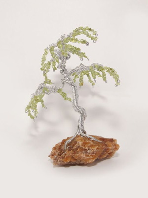 Handmade tree with peridot new on mineral calcite base