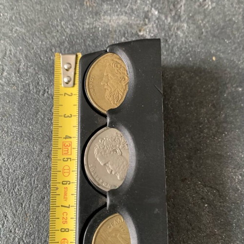 Coin holder used, as shown with coins