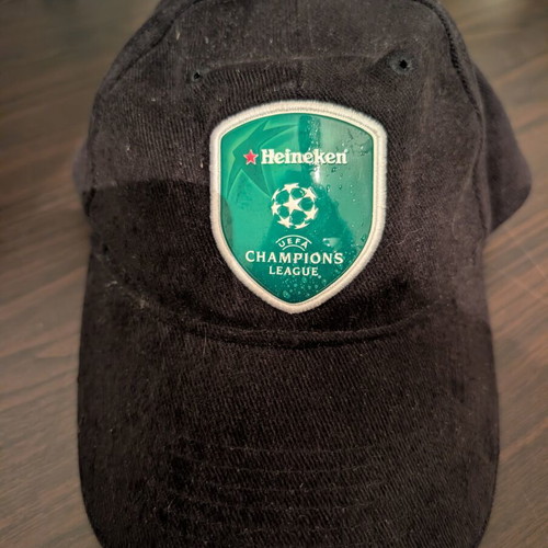 Black jockey hat with Heineken UEFA Champions League shield