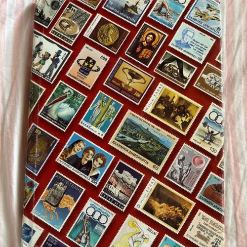 Stamp album like new, including Athens 2004 Olympic Games series